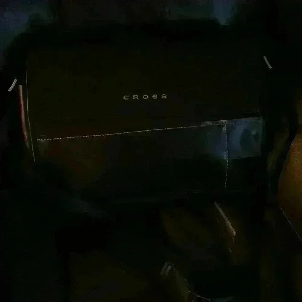 new CROSS leather and vinyl lap top brief case  will take a 15 inch max book pro